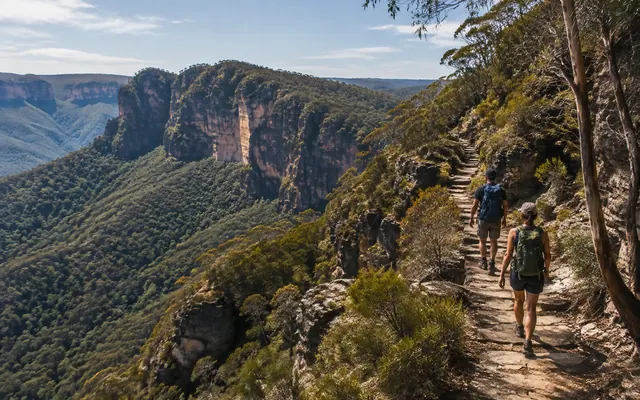 Hikers on a Blue Mountains cliffside trail
