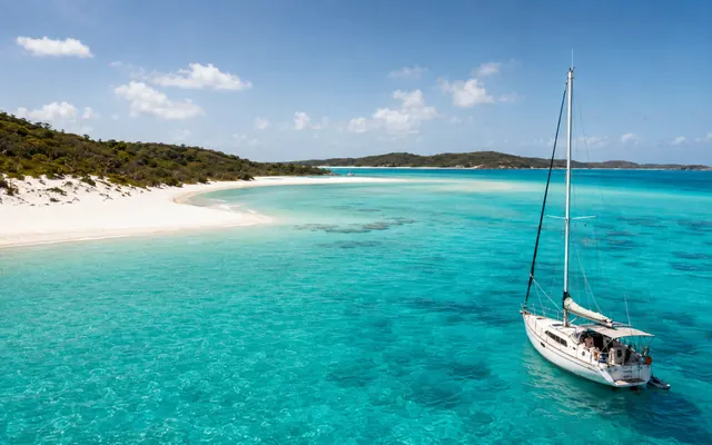 Sailing boat anchored off Whitehaven Beach